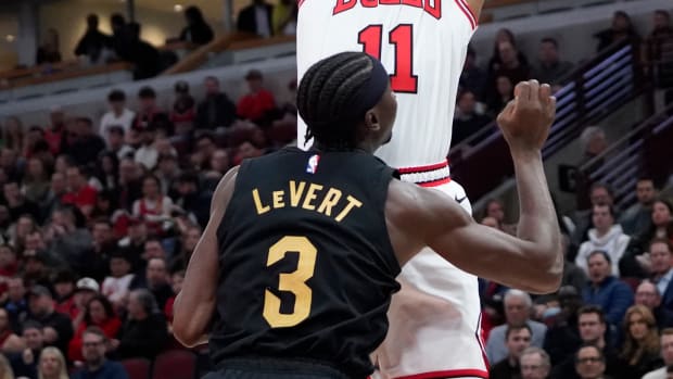 Feb 28, 2024; Chicago, Illinois, USA; Chicago Bulls forward DeMar DeRozan (11) shoots the ball over Cleveland Cavaliers guard Caris LeVert (3) during the first quarter at United Center. Mandatory Credit: David Banks-USA TODAY Sports
